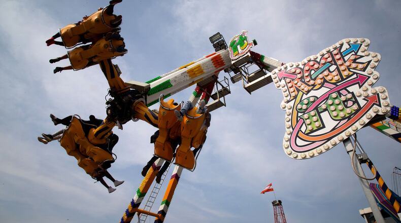 Fairgoers ride the Rock It, one of the rides at the Georgia State Fair at the Atlanta Motor Speedway Sunday, October 4, 2020.  STEVE SCHAEFER / SPECIAL TO THE AJC