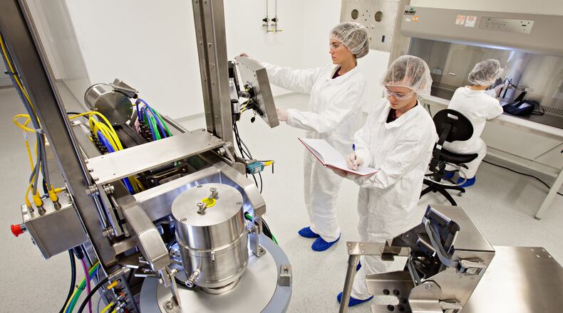Workers make vaccines with a centrifuge at the National Center for Therapeutics Manufacturing on the Texas A&M campus.
Photo: Texas A&M System