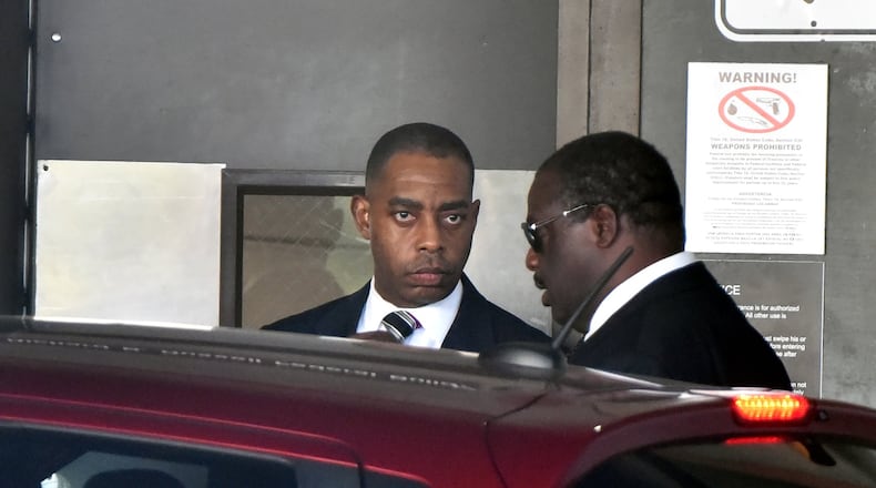 Former city procurement officer Adam Smith leaves the federal courthouse after his hearing in September. HYOSUB SHIN / HSHIN@AJC.COM