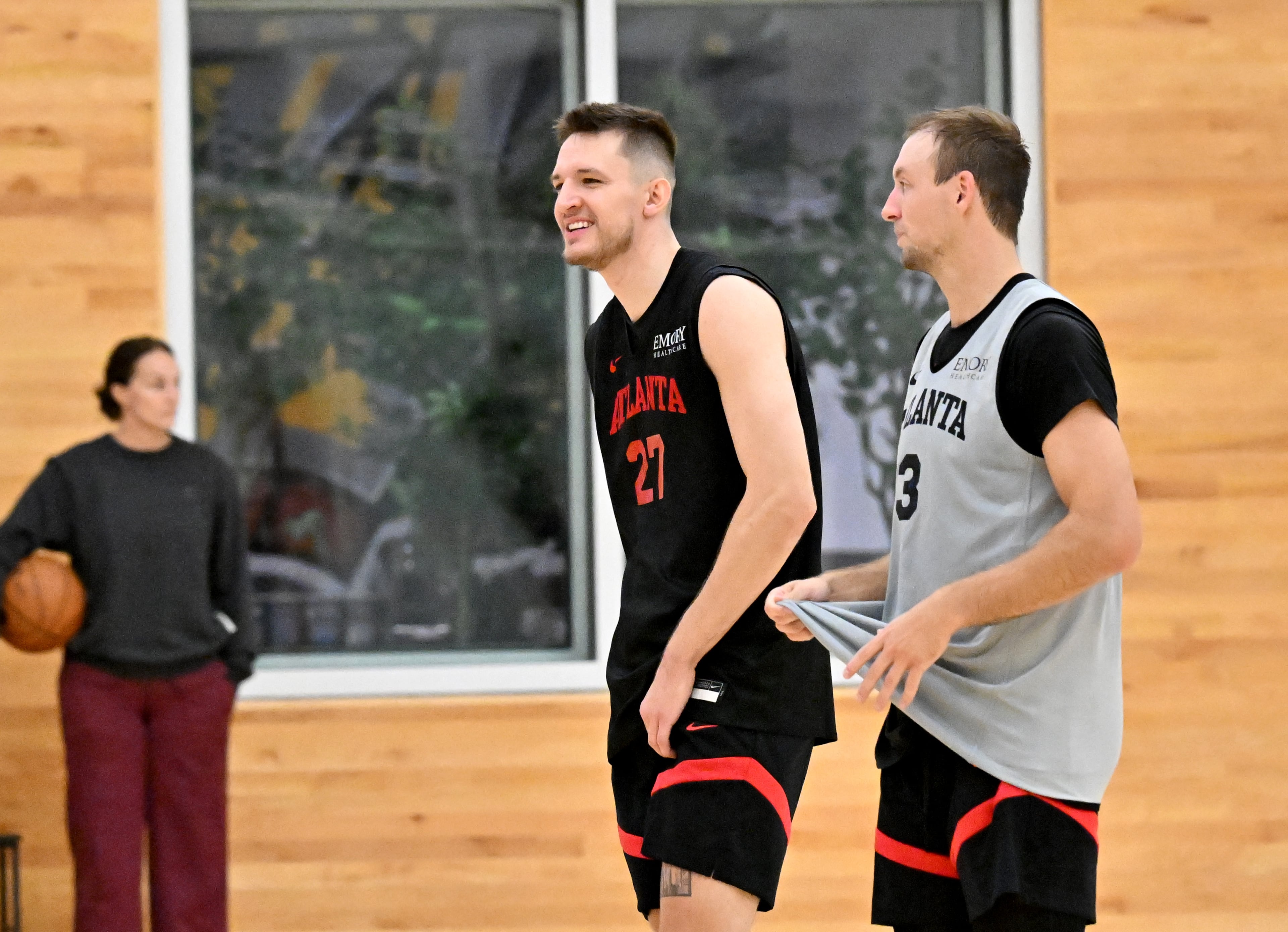 Hawks guards Vit Krejci (left) and Luke Kennard attend the first day of training camp at the team’s practice facility inside the Emory Sports Medicine Complex on Tuesday, Sept. 30, 2025, in Brookhaven. (Hyosub Shin/AJC)