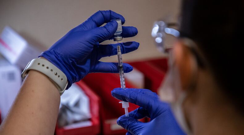 Nicole Costa, pharmacy manager at Amita Health Presence Medical Center in Joliet, Ill., prepares the COVID-19 vaccine to be administered to medical personnel on December 16, 2020. (Zbigniew Bzdak/Chicago Tribune/TNS)