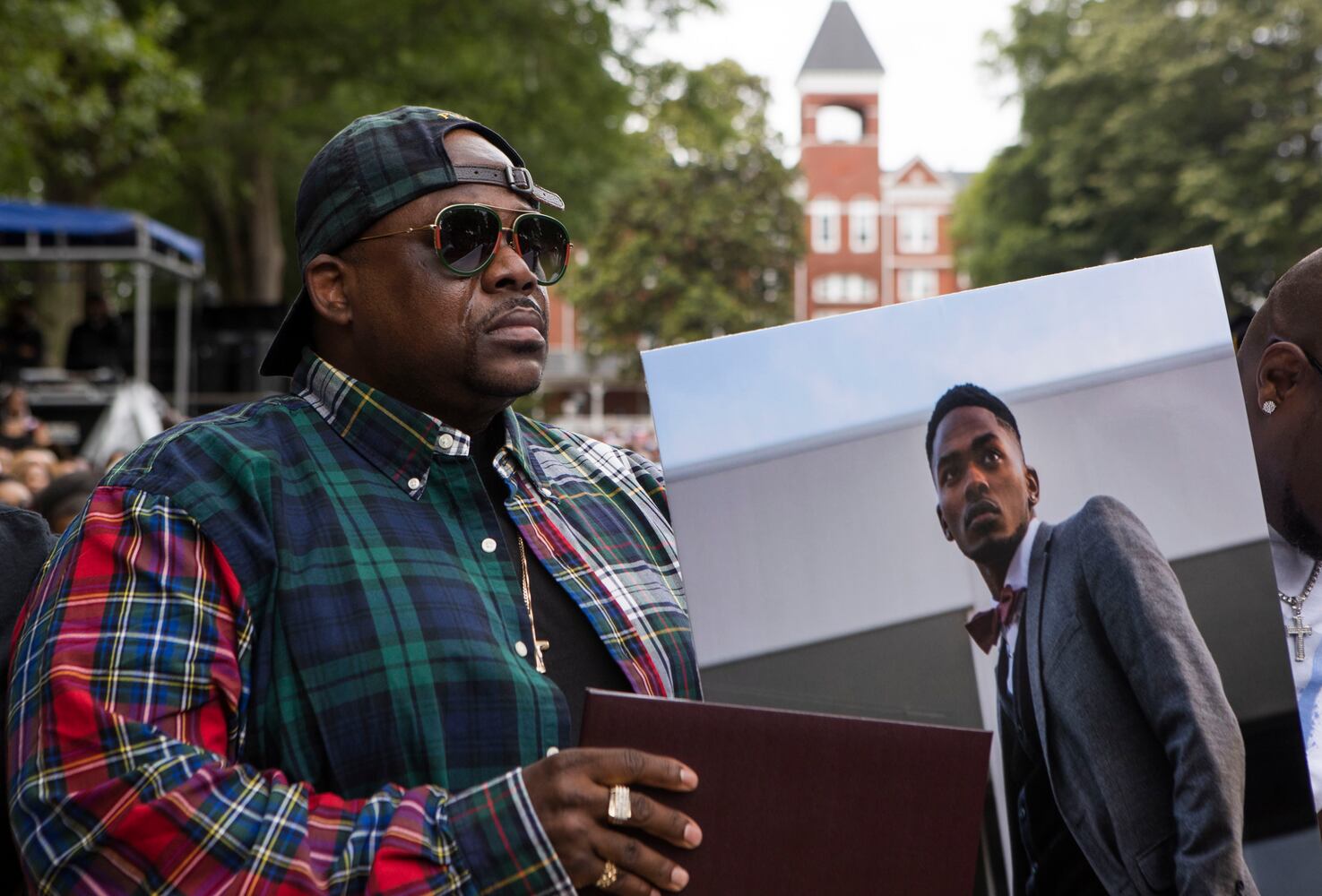 The father of a Morehouse College student who tragically passed away before graduating accepts a degree on his behalf during the Morehouse College commencement ceremony on Sunday, May 21, 2023, on Century Campus in Atlanta. The graduation marked Morehouse College's 139th commencement program. CHRISTINA MATACOTTA FOR THE ATLANTA JOURNAL-CONSTITUTION