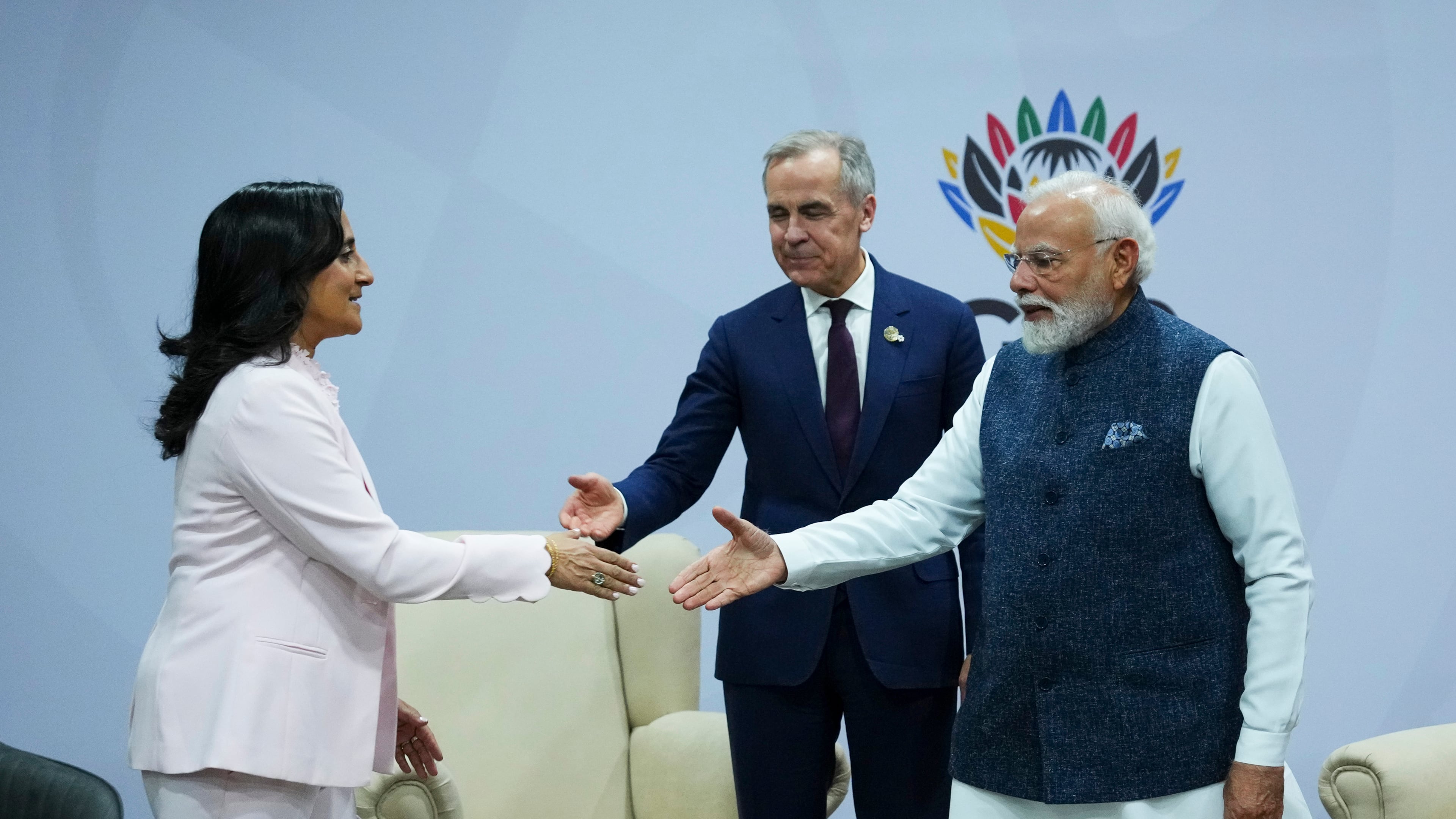 Canada's Prime Minister Mark Carney, middle, introduces Minister of Foreign Affairs Anita Anand, left, during a bilateral meeting with Indian Prime Minister Narendra Modi during the G20 Summit, in Johannesburg, Sunday, Nov. 23, 2025. (Sean Kilpatrick/The Canadian Press via AP)