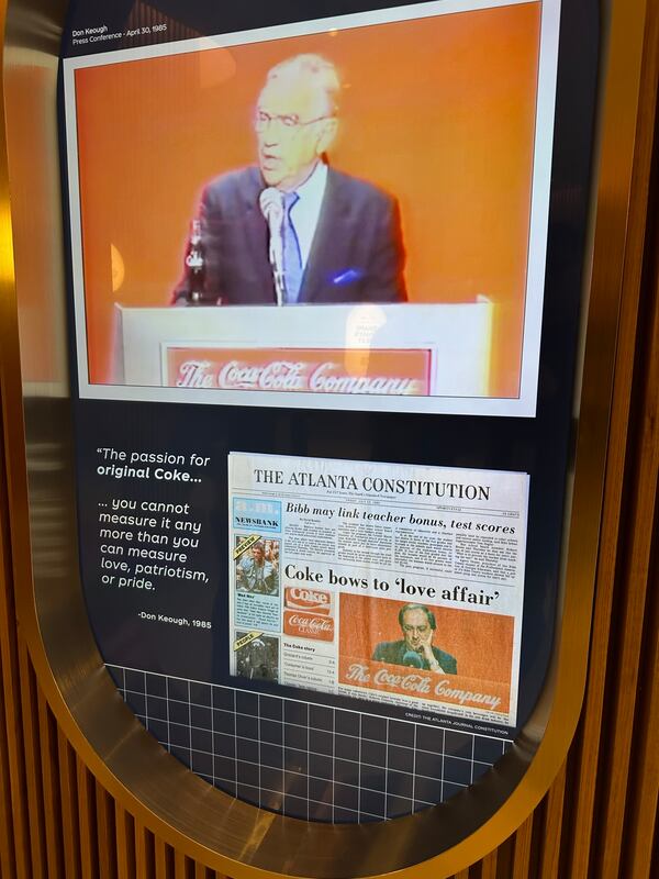 A video at the Beverage Lab at the World of Coca-Cola Museum shows The Atlanta Journal-Constitution story about Coca-Cola bringing back the original Coke formula in 1985 after backlash about New Coke. (Rodney Ho/AJC)