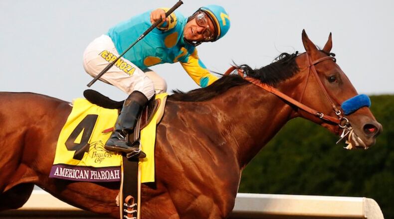 American Pharoah, with Victor Espinoza up, wins the Breeders' Cup Classic horse race at Keeneland race track Saturday, Oct. 31, 2015, in Lexington, Ky. (AP Photo/Brynn Anderson)