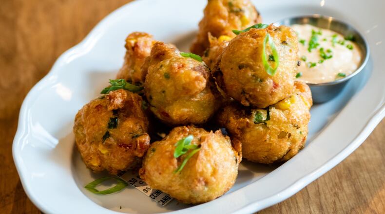 At Achie’s, Lowcountry Frogmore Fritters are an appetizer you can share, but we don’t blame you if you want to keep them for yourself. CONTRIBUTED BY HENRI HOLLIS