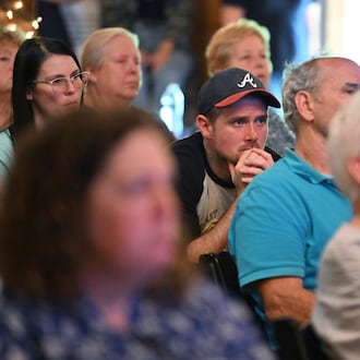 Attendees listen to presentations at the Chatsworth, Ga., town hall on Thursday, June 12, 2025. The group PFAS Georgia represents numerous residents and farmers in Dalton and Calhoun who allege their properties are contaminated with PFAS from the carpet industry. (Hyosub Shin/AJC)