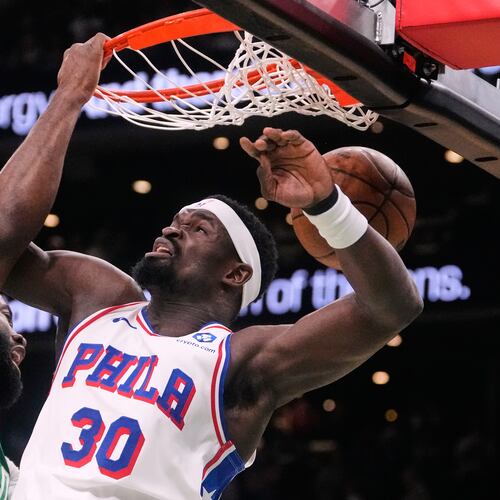 Boston Celtics guard Jaylen Brown (7) slams a dunk against Philadelphia 76ers center Adem Bona (30) during the first half of Game 2 of a first-round NBA playoffs basketball game, Tuesday, April 21, 2026, in Boston. (AP Photo/Charles Krupa)