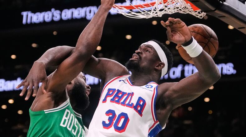 Boston Celtics guard Jaylen Brown (7) slams a dunk against Philadelphia 76ers center Adem Bona (30) during the first half of Game 2 of a first-round NBA playoffs basketball game, Tuesday, April 21, 2026, in Boston. (AP Photo/Charles Krupa)