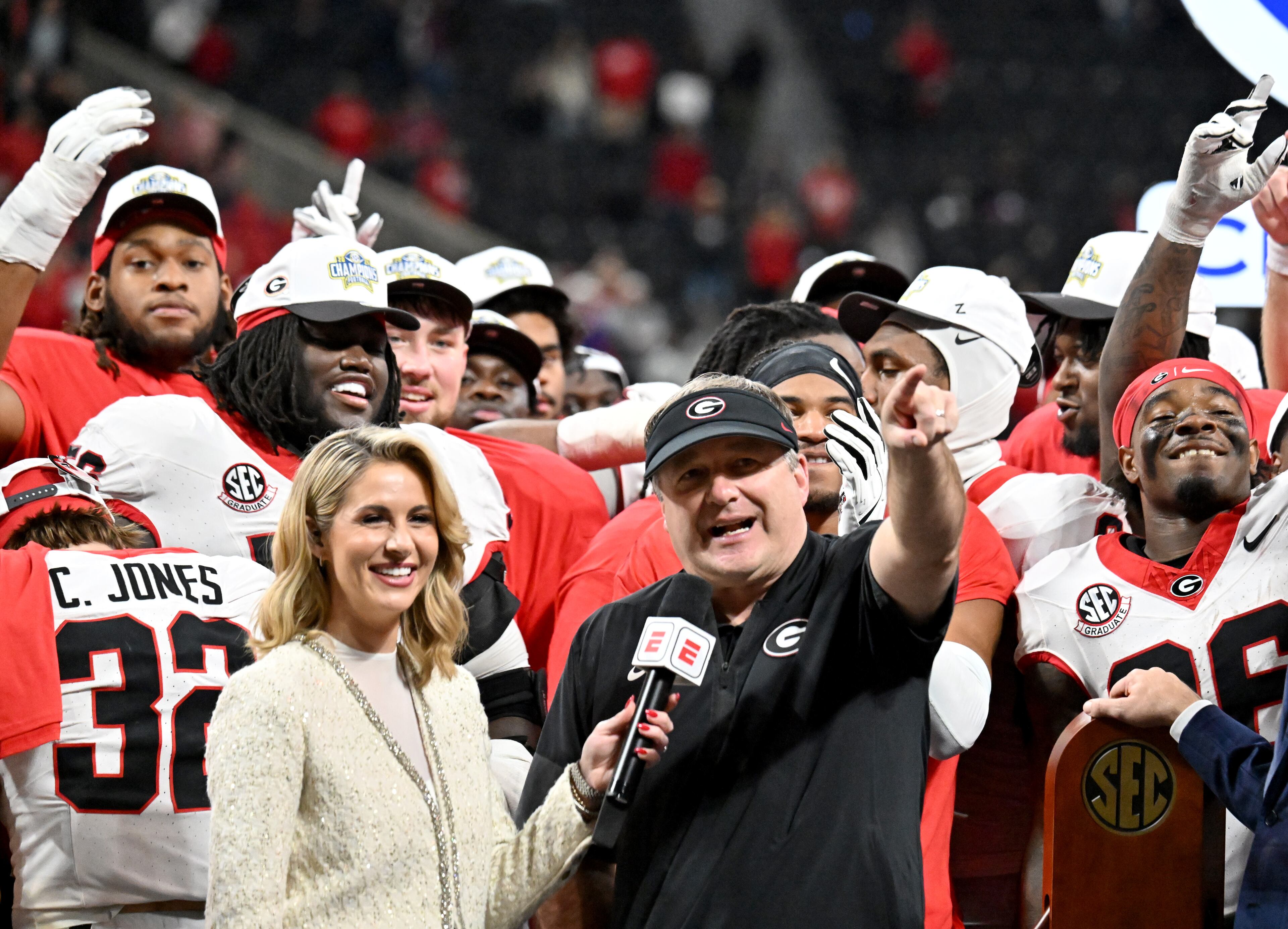 Georgia head coach Kirby Smart and players celebrate after defeating Alabama 28-7 in the SEC Championship football game at the Mercedes-Benz Stadium, Saturday, December 6, 2025 in Atlanta. (Hyosub Shin / AJC)