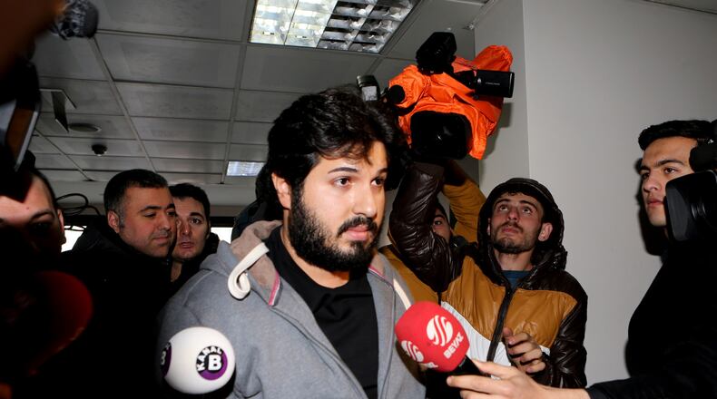 FILE - In this Tuesday, Dec. 17, 2013 photo, Turkish-Iranian businessman Reza Zarrab, who is charged currently in the U.S. for evading sanctions on Iran, is surrounded by the media members as he arrives at a courthouse in Istanbul, in a separate case against him. (Depo Photos via AP, File)