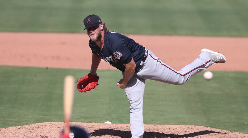 Atlanta Braves reliever A.J. Minter delivers against the Boston Red Sox during the fifth inning Monday, March 1, 2021, at JetBlue Park in Fort Myers, Fla. (Curtis Compton / Curtis.Compton@ajc.com)