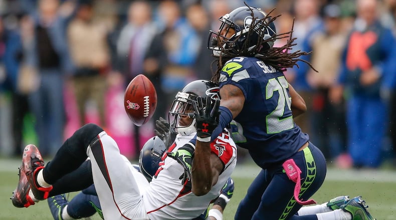 SEATTLE, WA - OCTOBER 16: Wide receiver Julio Jones #11 of the Atlanta Falcons can’t make the catch on fourth down as cornerback Richard Sherman #25 of the Seattle Seahawks defends at CenturyLink Field on October 16, 2016 in Seattle, Washington. (Photo by Otto Greule Jr/Getty Images)