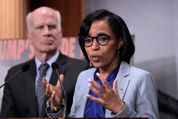 Sen. Angela Alsobrooks, D-Md., joined at left by Sen. Peter Welch, D-Vt., speaks to reporters about President Donald Trump' tariffs on foreign countries, at the Capitol, in Washington, Wednesday, April 2, 2025. (AP Photo/J. Scott Applewhite)