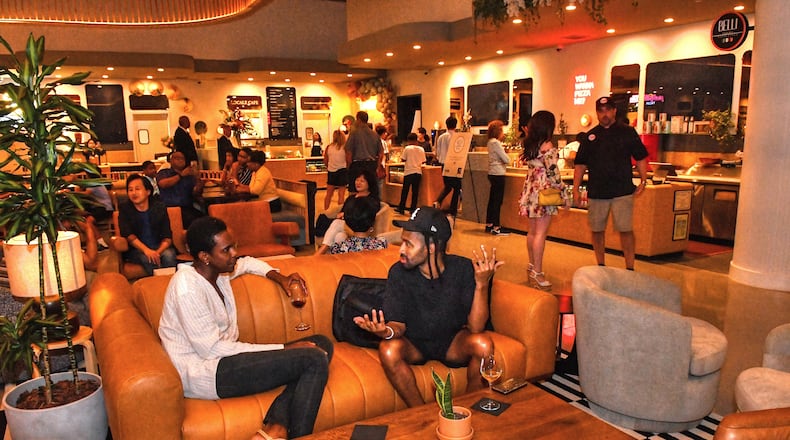 The dining area of the new Politan Row at Colony Square in Atlanta features nontraditional "food court" eating areas, including soft seating and a central bar. (Chris Hunt for The Atlanta Journal-Constitution)