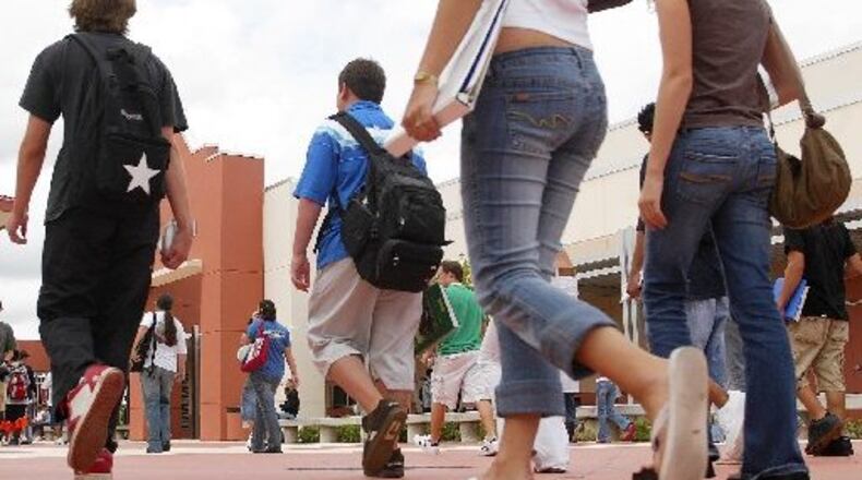 The Cherokee County School Board has renewed a partnership agreement with the Cherokee Chamber of Commerce to have members partner with individual schools, speak at career fairs and guide field trips. AJC FILE