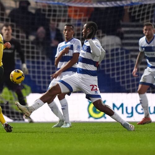 Wrexham's Ollie Rathbone, left, scores their side's third goal of the game during the Sky Bet Championship soccer match between Queens Park Rangers and Wrexham in London, Saturday Jan. 24, 2026. (Ben Whitley/PA via AP)