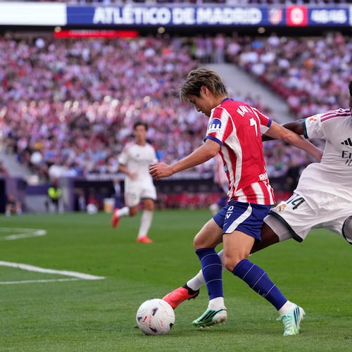 Atletico Madrid's Lee Kang-in tries to dribble the ball past Real Madrid's Aurelien Tchouameni, right, during a Spanish La Liga soccer match between Atletico Madrid and Real Madrid in Madrid, Sunday, Sept. 20, 2026. (AP Photo/Bernat Armangue)