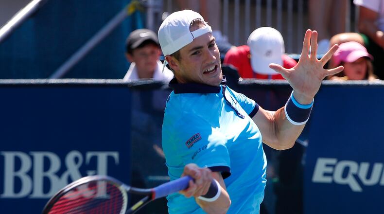 John Isner returns a forehand to Gilles Muller of Luxembourg during the BB&T Atlanta Open at Atlantic Station on July 29, 2017 in Atlanta. (Photo by Kevin C. Cox/Getty Images)