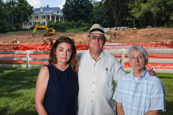 Roswell residents from left to right: Kelly Callen, Jere Wood, and Simone du Boise are shown near the site of where the City of Roswell has cleared trees on the Mimosa Hall property, Monday, June 23, 2025, in Roswell, Ga. The city of Roswell is clearing the site for a parking lot. Callen is a Roswell community organizer, du Boise is an architect and Wood is a former Mayor of Roswell. (Jason Getz/AJC)