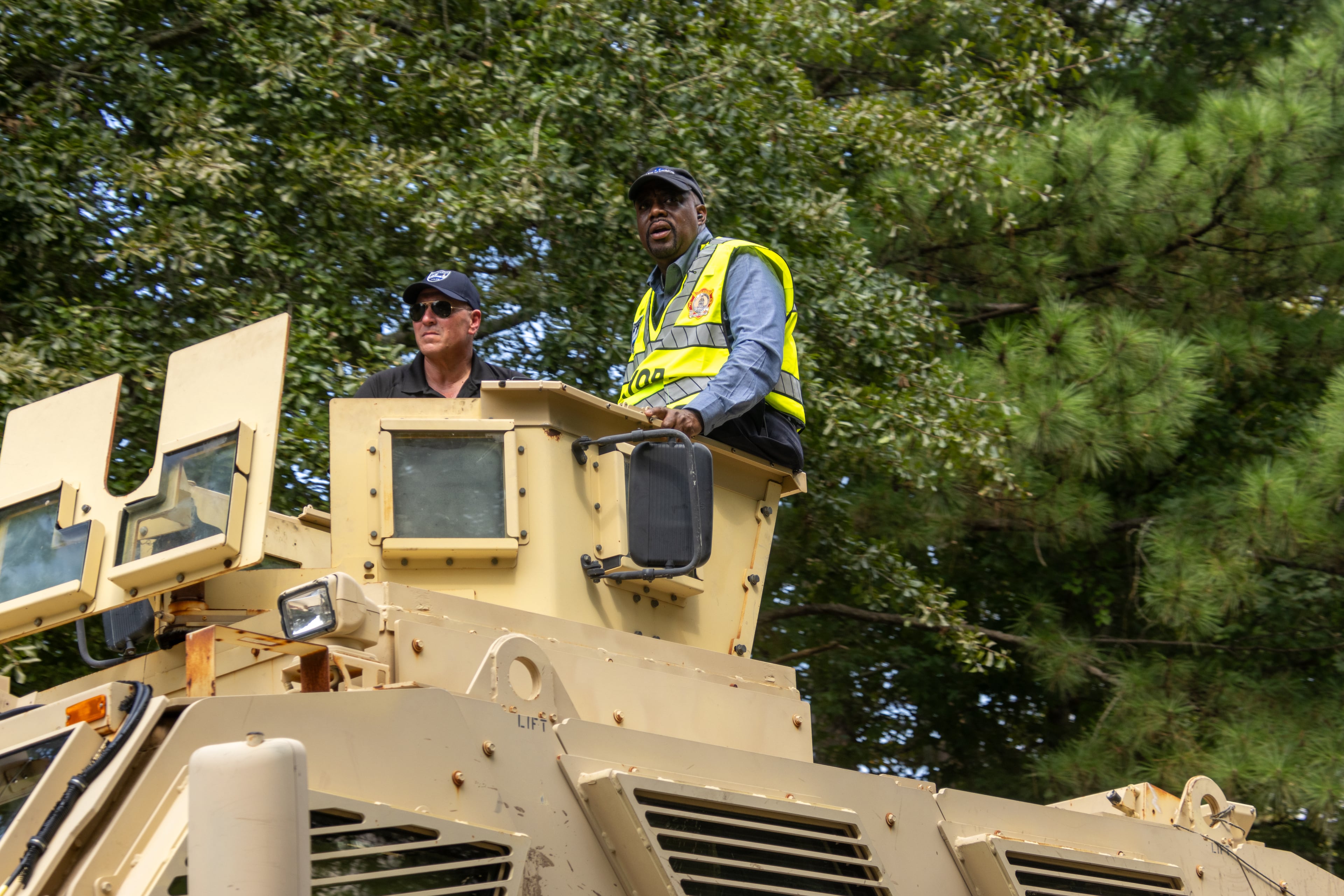 Savannah Mayor Van Johnson (right) road around in a military grade police unit to check on city after flooding last year.