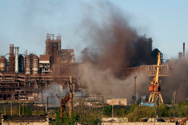 FILE - Smoke rises from the Metallurgical Combine Azovstal in Mariupol during shelling, in Mariupol, in territory under the government of the Donetsk People's Republic, eastern Ukraine, Saturday, May 7, 2022. (AP Photo/Alexei Alexandrov, File)