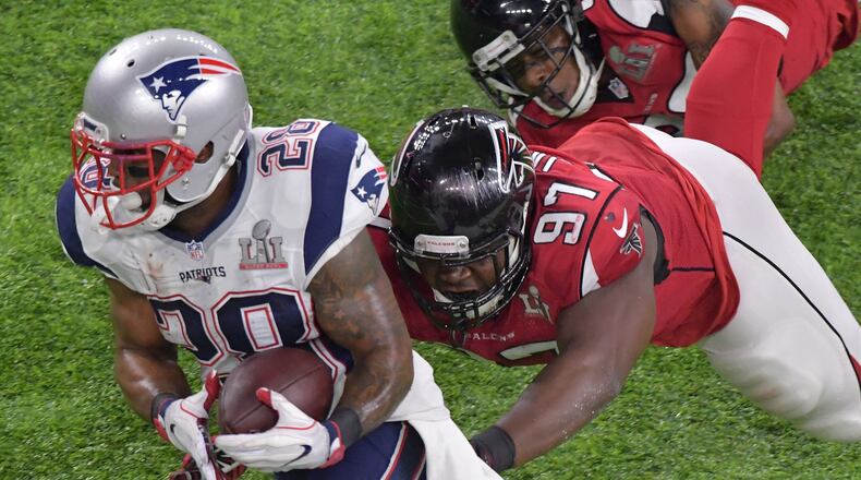Atlanta Falcons’ Grady Jarrett and Terron Ward take a selfie during opening night for the NFL Super Bowl 51 football game at Minute Maid Park Monday, Jan. 30, 2017, in Houston. (AP Photo/David J. Phillip)