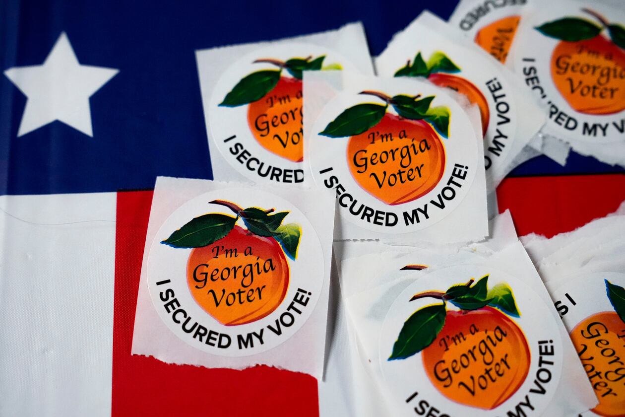Stickers sit on a table inside a polling place in Atlanta. (Brynn Anderson/AP 2024)