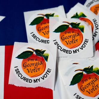 Stickers sit on a table inside a polling place in Atlanta. (Brynn Anderson/AP 2024)