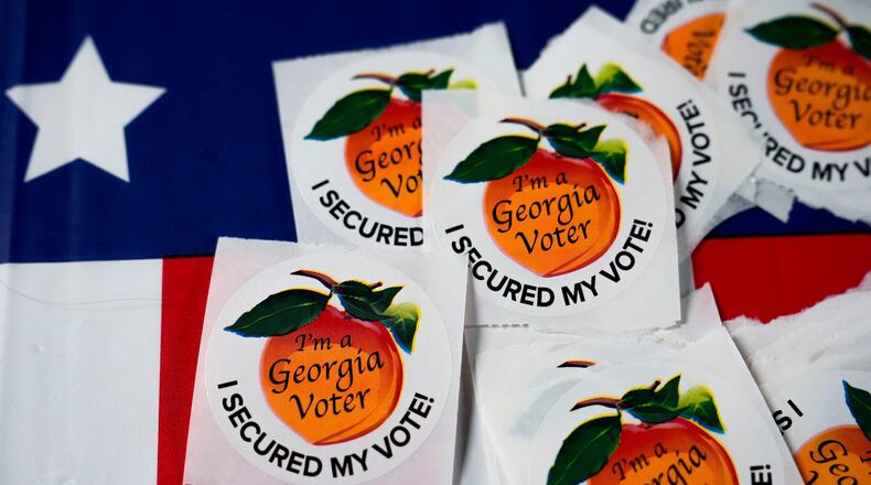 Stickers sit on a table inside a polling place in Atlanta. (Brynn Anderson/AP 2024)