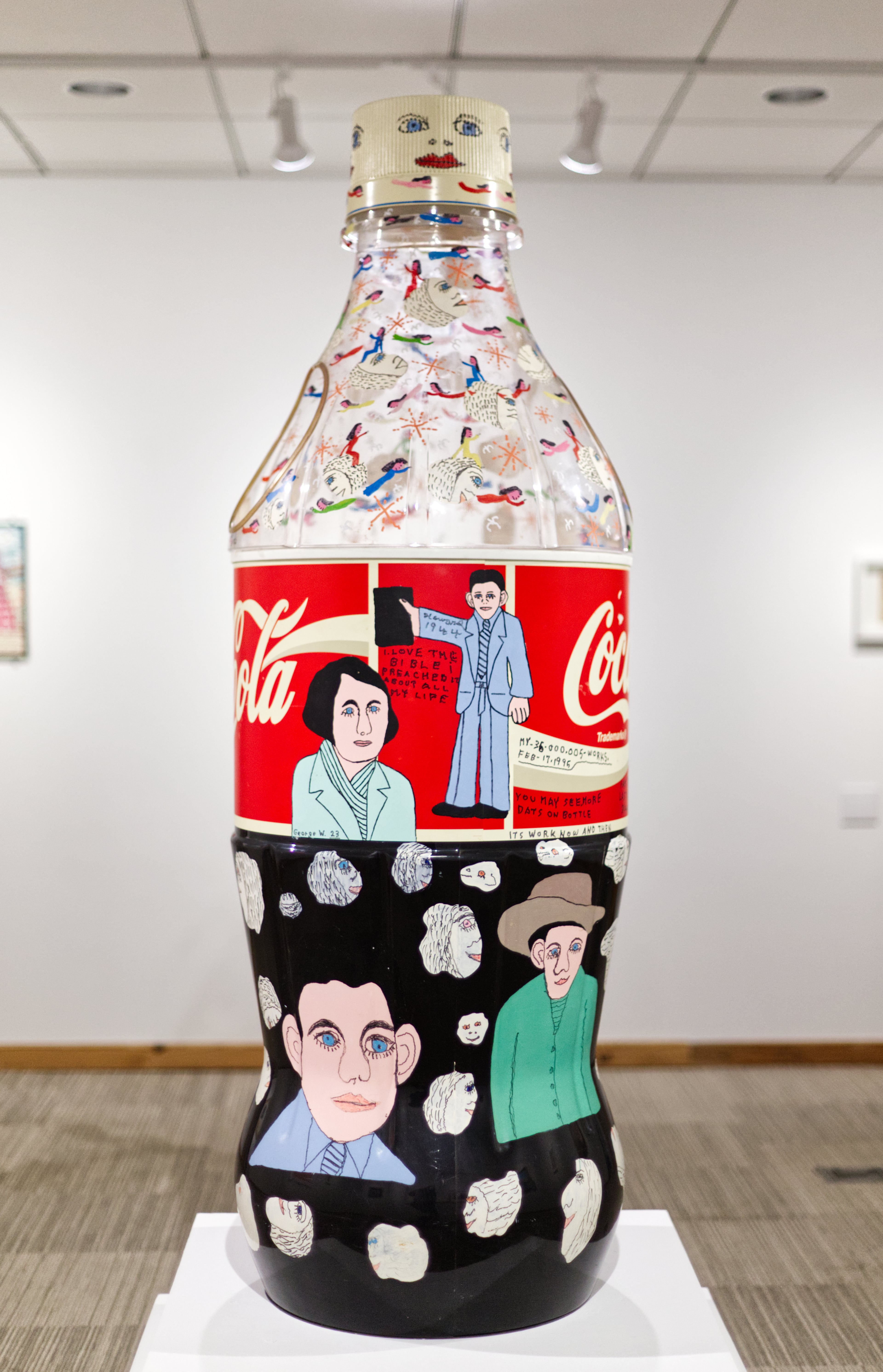 Howard Finster, who appreciated American ingenuity, celebrated Atlanta-based Coca-Cola in many sizes and varieties of his art. That included everything from painted wooden cutouts of the classic bottles and prints all the way to this 58-inch-tall decorated store display (1996). (Photo by Dustin Timbrook)