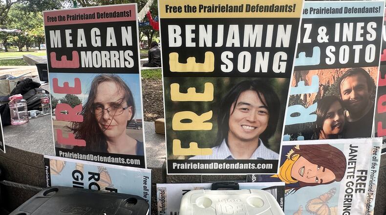 Supporters of protesters convicted over a shooting outside a Texas immigration detention center display signs in support of the defendants outside a federal courthouse in Fort Worth, Texas on Tuesday, June 23, 2026. (AP Photo/Kendria LaFleur)