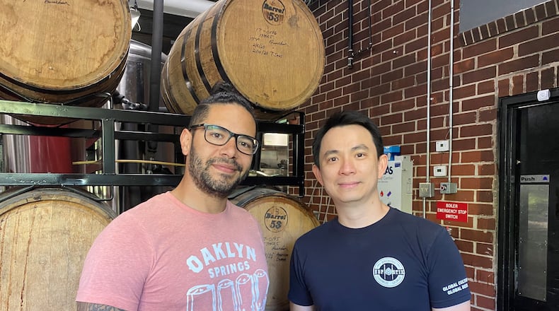Hopstix brewer Justin Ramirez (left) and owner Andy Tan are selecting some barrel-aged beers for the 5th anniversary celebration.
Bob Townsend for The Atlanta Journal-Constitution