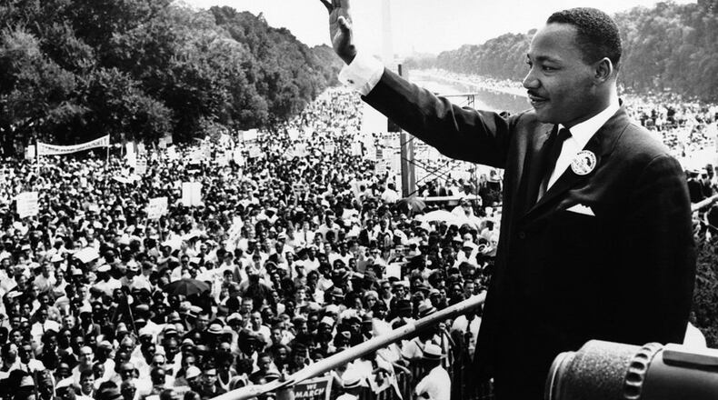 Martin Luther King, Jr. waves from the steps of the Lincoln Memorial during the Aug. 28, 1963 March on Washington.