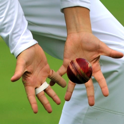 FILE - View of cricketer's hands catching a cricket ball during day four of the first Ashes Test cricket match, in Cardiff, Wales, Saturday, July 11, 2015. (AP Photo/Rui Vieira, file)