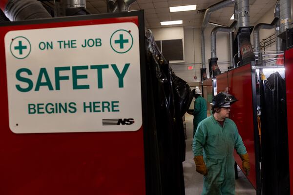 Welder trainees learn at the Norfolk Southern Training Center in McDonough on March 7. It's the only nationally accredited welding certification testing site in Georgia.  Arvin Temkar/AJC