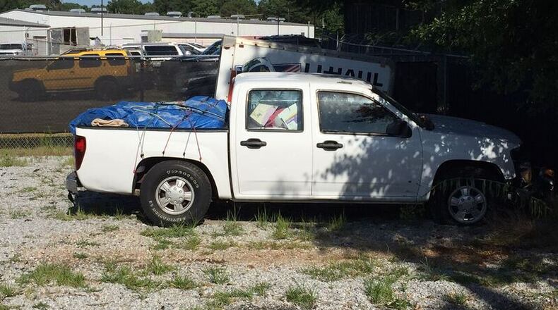 Rita Watson, 64, lost control of a 2006 Chevrolet Colorado, hit her 29-year-old son, and crashed into a building. (Credit: Gwinnett County Police Department)