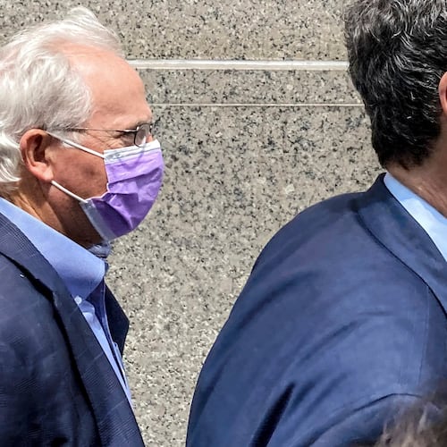 FILE — Former U.S. Rep. Stephen Buyer, left, trails his lawyer as he leaves Manhattan federal court after pleading not guilty to charges that he participated in an insider trading scheme while working as a consultant, July 27, 2022, in New York. (AP Photo/Larry Neumeister, File)