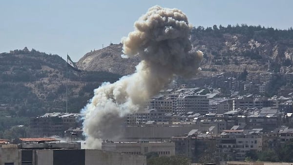 In this photo released by the Syrian official news agency SANA, smoke rises from an Israeli airstrike that hit the Syrian Defence Ministry, in Damascus, Syria, Wednesday, July 16, 2025. (SANA via AP)