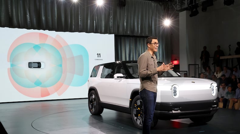 Founder and CEO of Rivian RJ Scaringe speaks onstage during the Rivian Reveals All-Electric R2 Midsize SUV event at Rivian South Coast Theater on March 7, 2024, in Laguna Beach, California. (Phillip Faraone/Getty Images for Rivian/TNS)