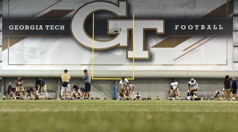 Georgia Tech players warm up during the first day of Georgia Tech football practice at Rose Bowl Field in Georgia Tech campus on Friday, August 4, 2017. HYOSUB SHIN / HSHIN@AJC.COM