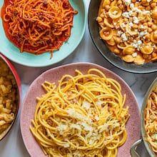 Get a tasty pasta dinner on the table using ingredients you already have at home. Clockwise from top left: Chili Crisp Assassin's Spaghetti, Tagine-Inspired Pasta e Ceci, Muffuletta Pasta, German-Inspired Carbonara and Miso-Kimchi Macaroni and Cheese. (Aaliyah Man for the AJC)