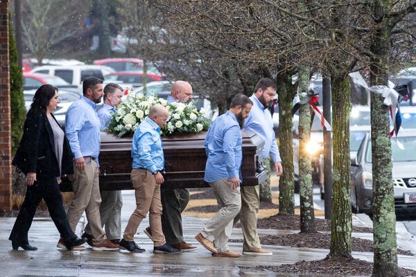The casket of Laken Riley, a 22-year-old nursing student who was killed in February on the University of Georgia’s campus, is brought to a hearse following her funeral at Woodstock City Church in Woodstock . (Arvin Temkar / arvin.temkar@ajc.com)