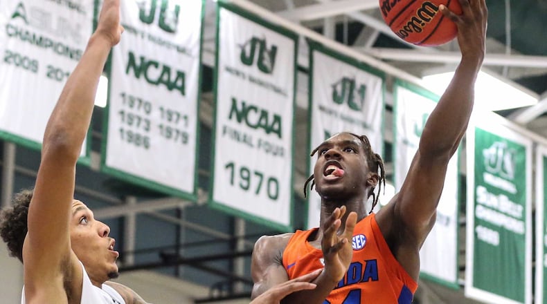 Deaundrae Ballard (right, No. 24) was the 65th best prospect in the country last year. The Southwest Atlanta Christian product will try to help Florida get back to the NCAA tournament.