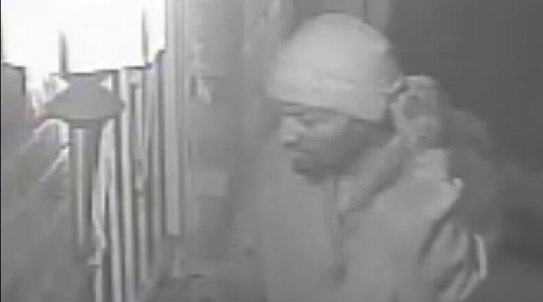 A man was killed near at his home Wednesday. Atlanta police released footage of a person of interest. (Credit: Atlanta Police Department)