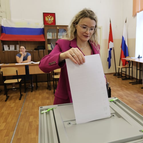 A woman casts her ballot in the parliamentary election in Vladivostok, Russia, Friday, Sept. 18, 2026. (AP Photo)