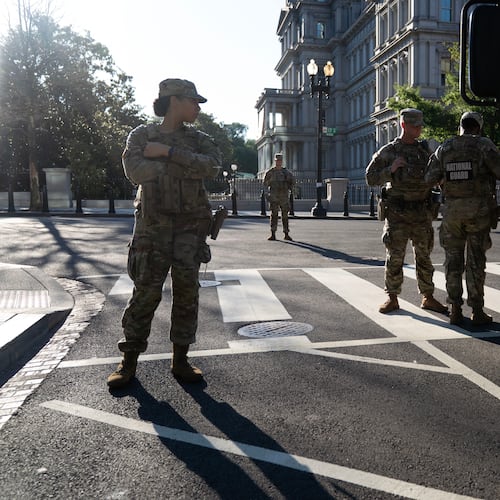Members of the National Guard stands guard the streets near the White House complex Saturday, June 13, 2026, in Washington. (AP Photo/Jose Luis Magana)