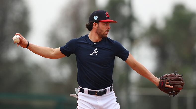 Dansby Swanson prepares to throw after fielding a ground ball. (Curtis Compton/ccompton@ajc.com)