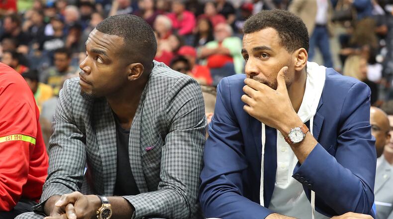 Injured Atlanta Hawks forwards Paul Millsap (left) and Thabo Sefolosha watch from the bench as the Hawks fall 107-92 to the Brooklyn Nets in a NBA basketball game on Sunday, March 26, 2017, in Atlanta. It is the Hawks seventh consecutive loss and the fifth consecutive game Paul Millsap has missed. Curtis Compton/ccompton@ajc.com
