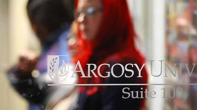 Argosy University students wait inside the Atlanta Campus to find out information on the future of the university on Thursday, March 7, 2019, in Dunwoody. Cash-strapped Argosy University may close its Atlanta campus for good on Friday.